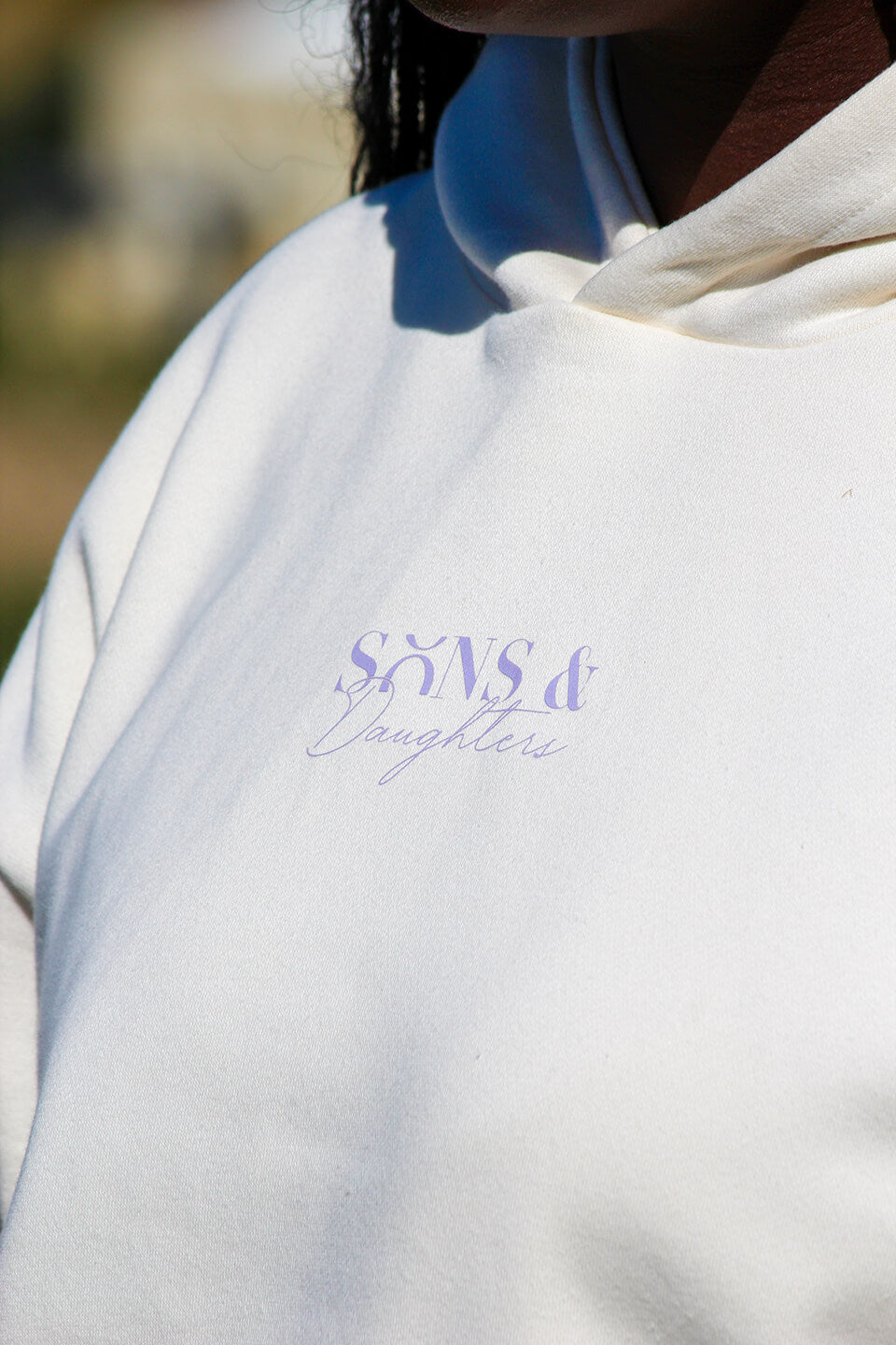 Close up of the front of the Sons and Daughters Rejoice Hoodie in Ivory